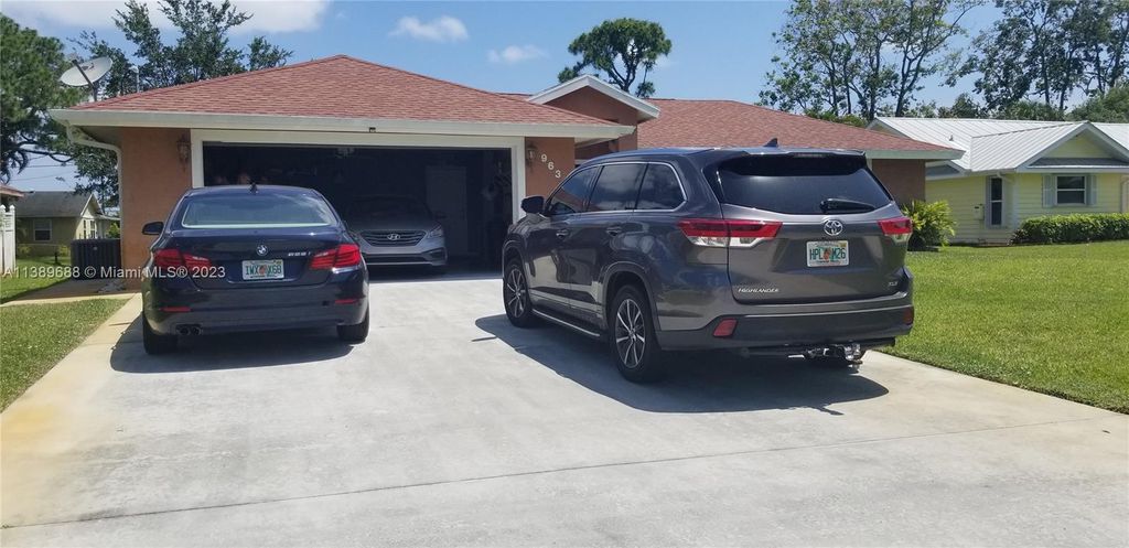 Photo of 963 SE Atlantus Ave, Port Saint Lucie, FL 34983 (MLS # A11389688)