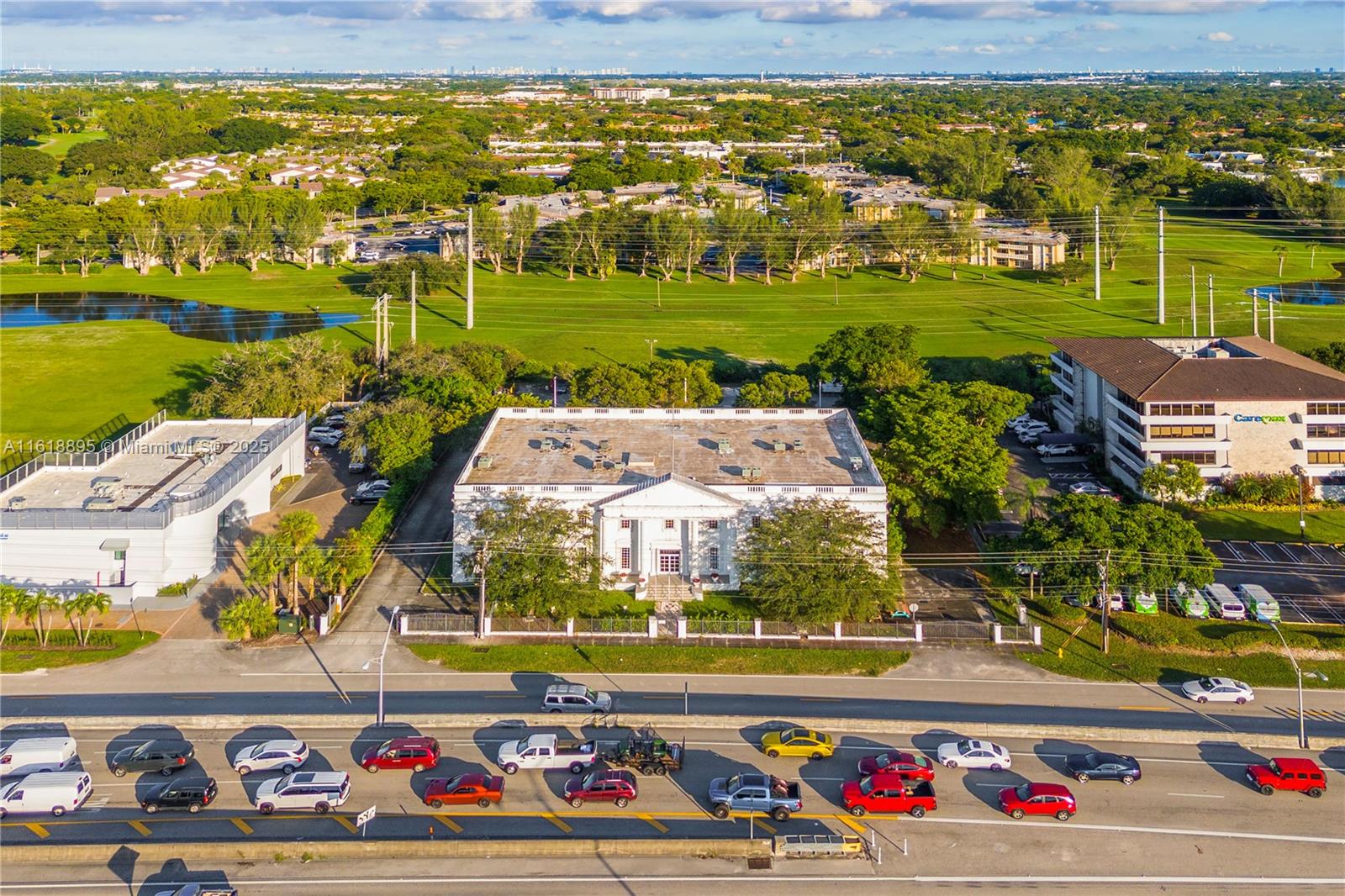 AMAZING OPPORTUNITY REDUCED! A genuinely iconic building stands by the Palmetto Expwy. The White House of Miami Lakes landmarks the area like no other. Whether you seek distinctive business space or a prominent opportunity, it offers an unmatched blend of location, architecture, and potential. It is not just a property; it's a statement. Its iconic architecture, prime location with hundreds of millions in development in under half a mile, and versatile potential uses make it a great investment and an exceptional asset.
Looking to relocate operations, begin medical practices, or open a new school with a promising opportunity, this property checks all the boxes. Take advantage of a chance to own a piece of Miami Lakes history and create a bright future for business or portfolio.