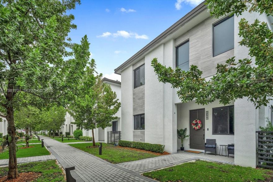 Well-maintained Tenerife model in Canarias at Downtown Doral. Built in 2022, this 4-bedroom, 3.5-bathroom home offers 2,863 sq ft with a 2-car garage. Layout features an open living area, covered terrace, front porch, and four walk-in closets. Kitchen includes upgraded cabinetry, premium countertops, and a built-in wine cooler. Ceramic tile floors downstairs, laminate upstairs. Primary and secondary bathrooms have been upgraded with glass shower enclosures. Smart home setup includes Google home automation, electric curtains, keypad entry, and alarm contacts. Full-size washer/dryer included. Garage has ceiling storage. Community amenities include pool, clubhouse, gym, basketball courts, covered running track, and kids' game room. Walking distance to Downtown Doral shops, restaurants, and Charter Schools. Easy access to Publix and Baptist Urgent Care.