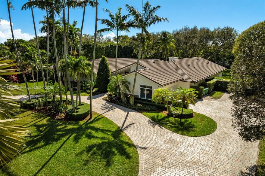 Welcome to this exquisite sanctuary on the prestigious Rolling Rd in Pinecrest, offering elegance and privacy behind two gated entrances. This home boasts five spacious bedrooms, including two luxurious primary suites, along with six well-appointed bathrooms, each with its own ensuite and porcelain floors. Warm wood flooring runs throughout the home, enhancing its inviting atmosphere. The chef’s kitchen boasts Quartzite countertops, Wolf, and Sub-Zero appliances, seamlessly flowing into a stylish bar with illuminated Onyx countertops. The backyard is an entertainer’s dream with two covered terraces, a summer kitchen, a sparkling pool and jacuzzi, a playground, a cozy fire pit with a sitting area, and lush landscaping for ultimate relaxation.