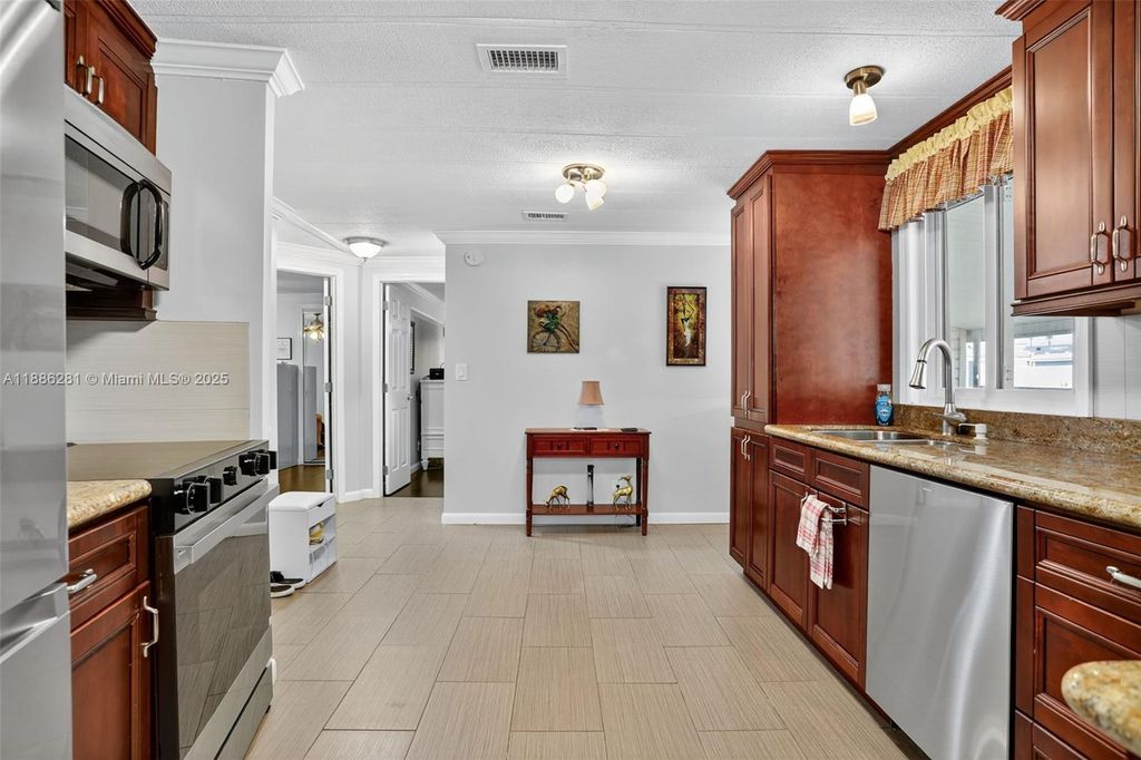 Photo of 123 NW 51st Ct, Deerfield Beach, FL 33064 (MLS # A11886281)