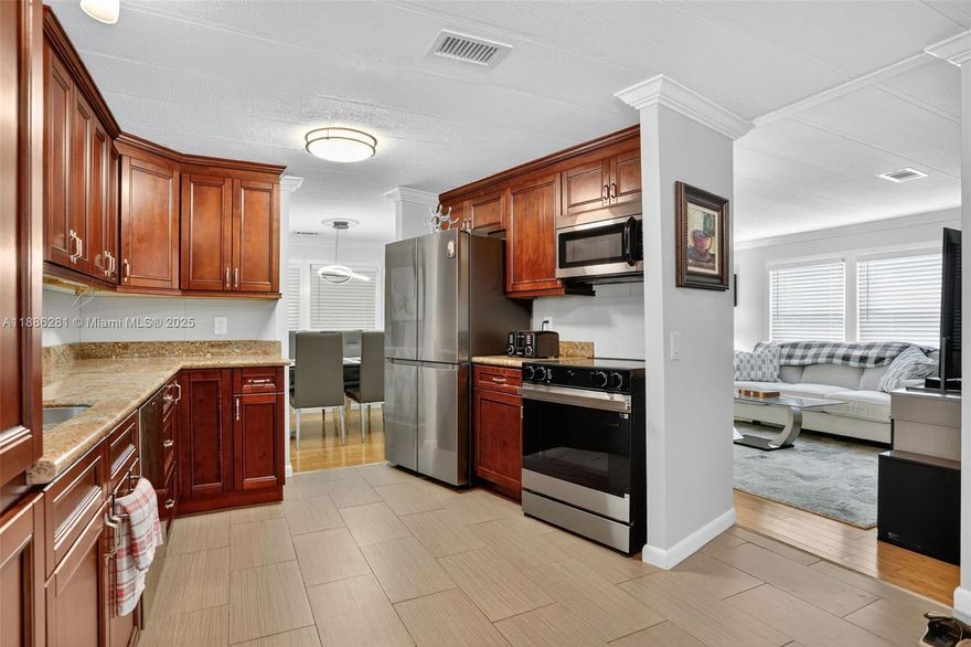 Welcome to Highland Meadows Estates East, Broward’s pristine 55+ gated mobile home community with no land lease. This move-in ready 2BR/2BA home showcases a gorgeous granite kitchen with NEW stainless steel appliances, crown molding, wood blinds, formal dining, and a light-filled Florida room for year-round enjoyment. Hardwood floors in bedroom, tile floors in kitchen/baths. Major updates include AC (2 yrs), washer/dryer (4 yrs), water heater (1 yrs), and a durable metal roof. A 1-car attached carport adds convenience. Community amenities include clubhouse, pool, shuffleboard, picnic area, sidewalks, and on-site management. Small pets welcome. HOA $117/month, paid quarterly. Sorry, no corporate ownership.