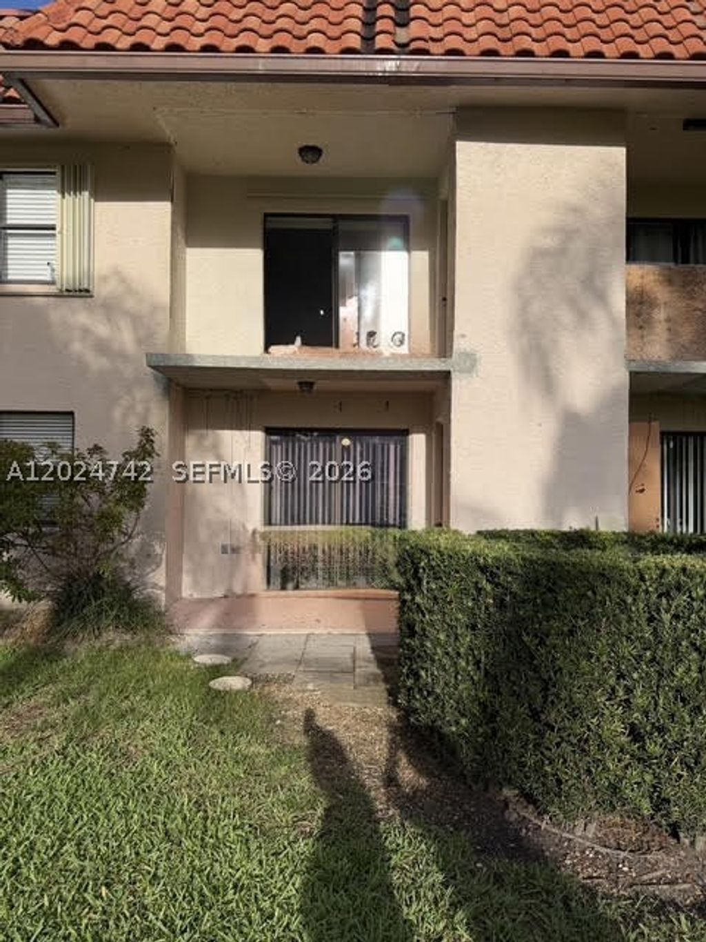 Photo of 15718 E Waterside Cir #102, Sunrise, FL 33326 (MLS # A12024742)