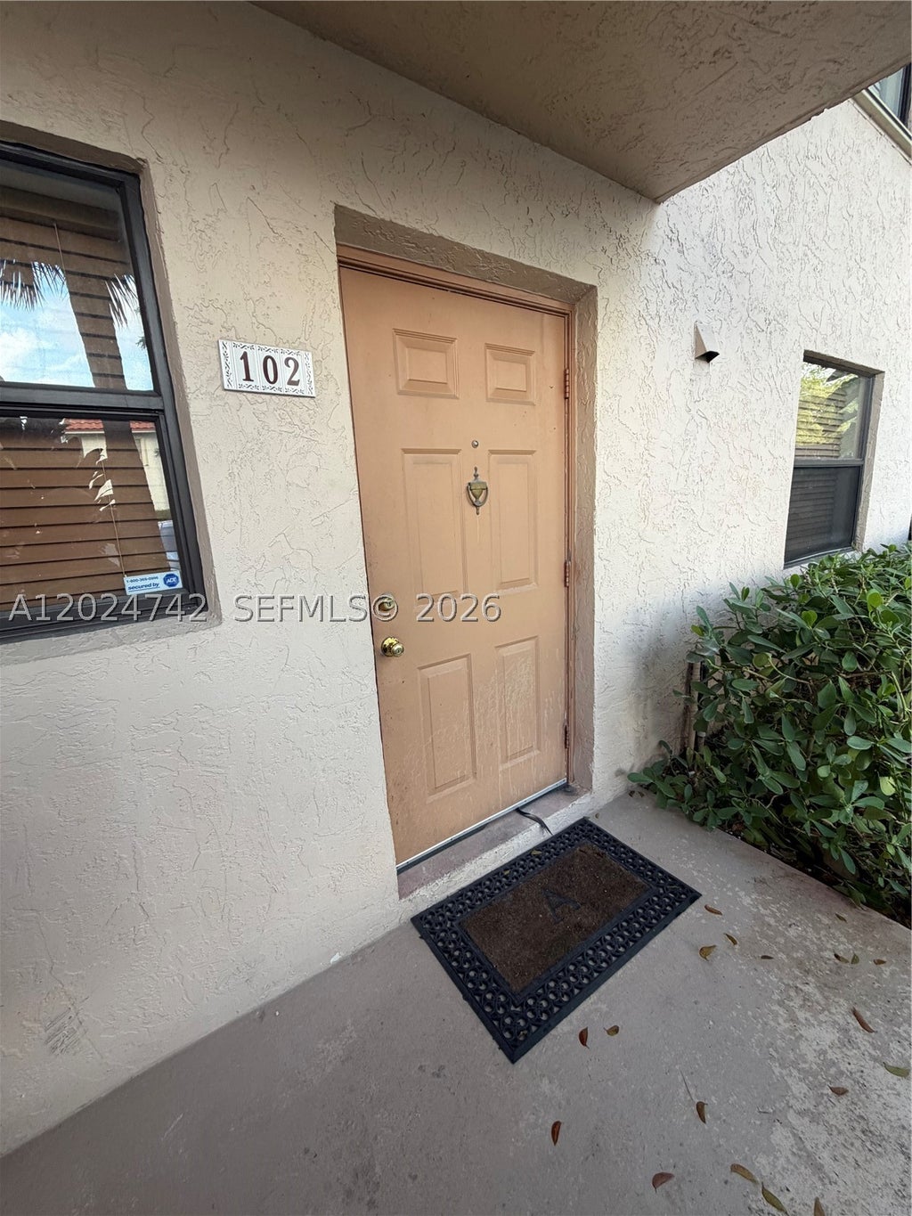 Photo of 15718 E Waterside Cir #102, Sunrise, FL 33326 (MLS # A12024742)