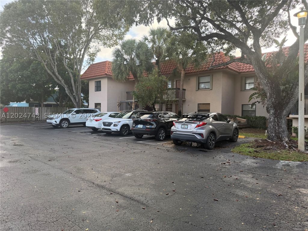 Photo of 15718 E Waterside Cir #102, Sunrise, FL 33326 (MLS # A12024742)