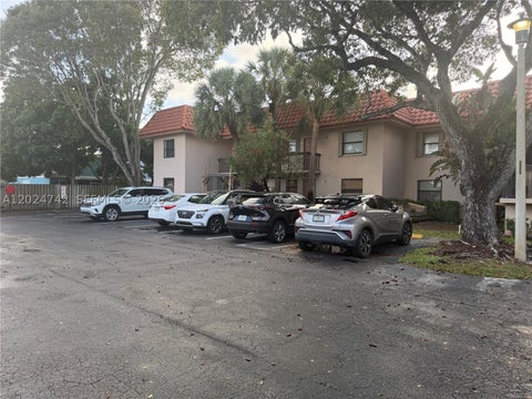Photo of 15718 E Waterside Cir #102, Sunrise, FL 33326 (MLS # A12024742)