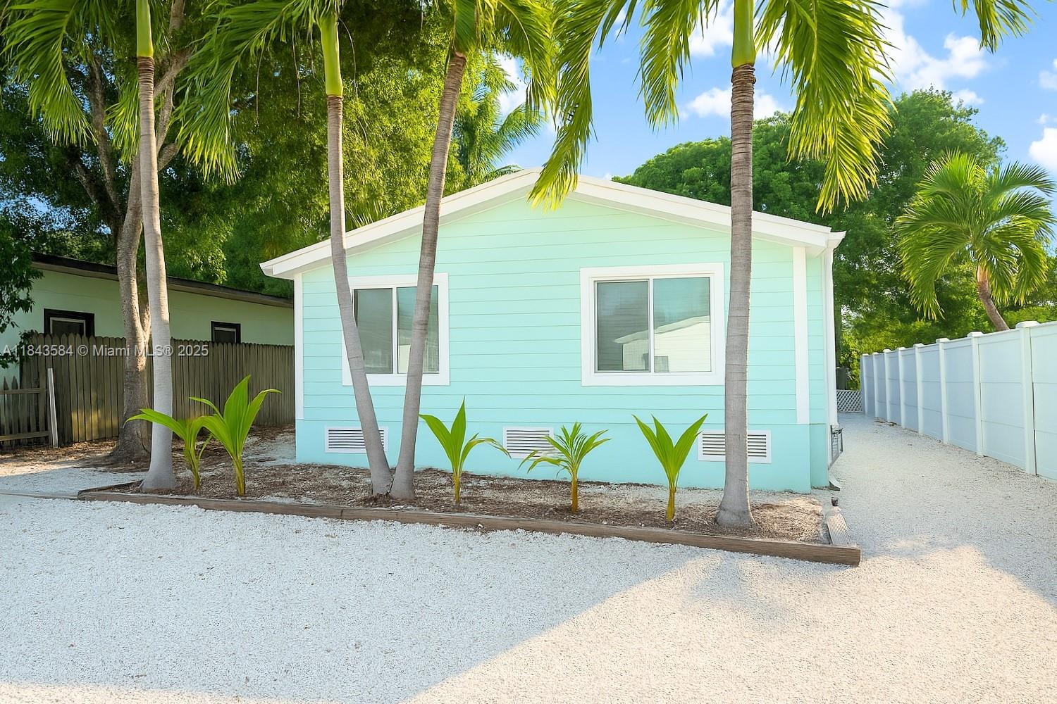 Beautifully updated home in the heart of Tavernier, just minutes from Harry Harris Park. Featuring vaulted ceilings, impact windows and doors, an open layout, and fresh interior paint throughout. The kitchen includes a gas stove and flows effortlessly into bright living spaces. The home has been thoughtfully upgraded for peace of mind with new plumbing, a sealed crawl space with humidity control, and reinforced structural improvements. Exterior cement-style siding gives the look of a CBS home. A brand-new front deck is coming soon, and a generator plug-in is already in place. Just a short golf cart ride away, enjoy Harry Harris Park with its sandy beach, playground, and deep-water, easy-access boat ramp on the ocean side! This turnkey home is a must-see!