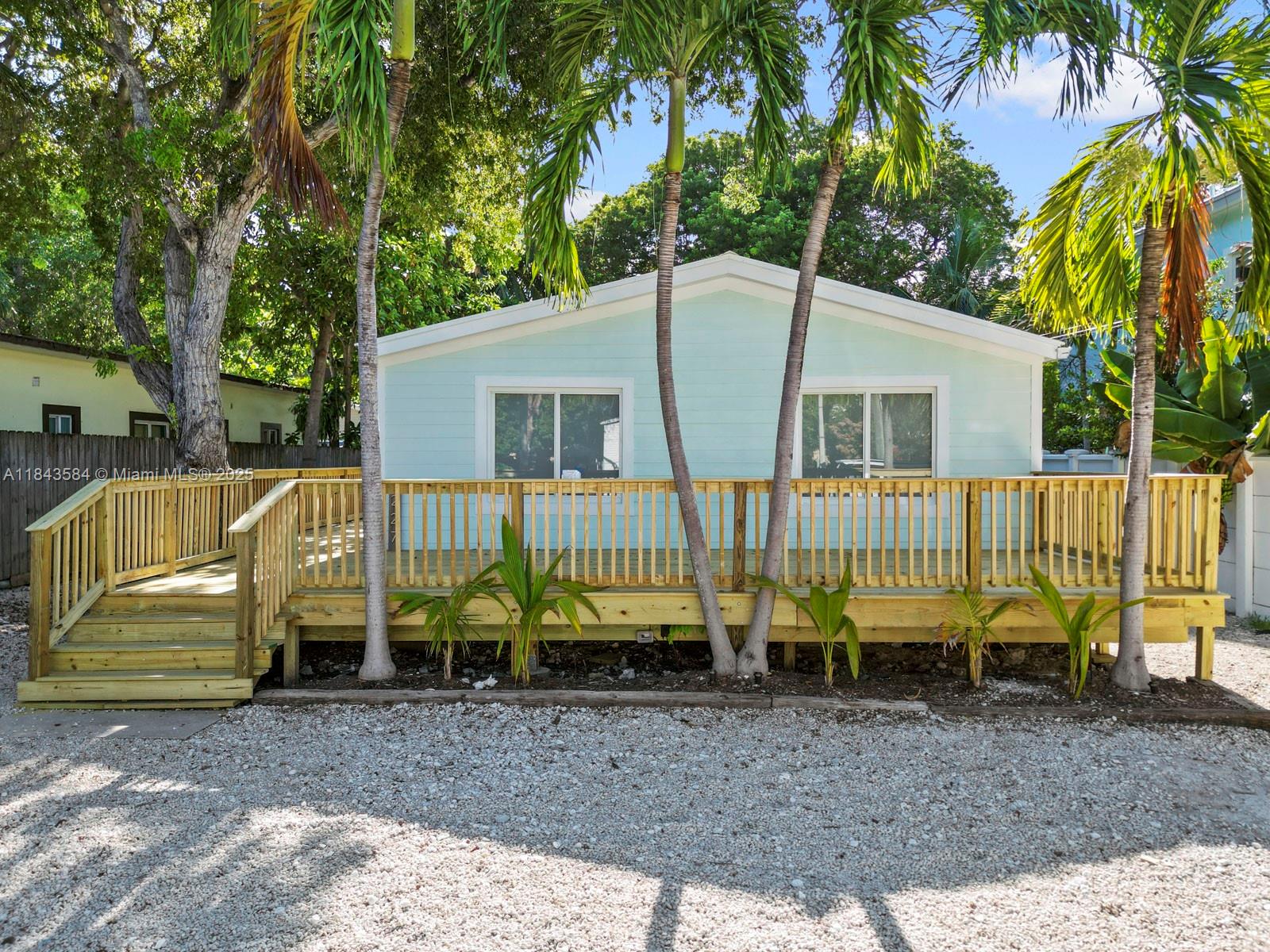 PRICE REDUCED. Seller says sell! Beautifully updated home in the heart of Tavernier, just minutes from Harry Harris Park. Featuring vaulted ceilings, impact windows and doors, an open layout, and fresh interior paint throughout. The kitchen includes a gas stove and flows effortlessly into bright living spaces. The home has been thoughtfully upgraded for peace of mind with new plumbing, a sealed crawl space with humidity control, and reinforced structural improvements. Exterior cement-style siding gives the look of a CBS home. A brand-new front deck is coming soon, and a generator plug-in is already in place. Just a short golf cart ride away, enjoy Harry Harris Park with its sandy beach, playground, and deep-water, easy-access boat ramp on the ocean side! This turnkey home is a must-see!