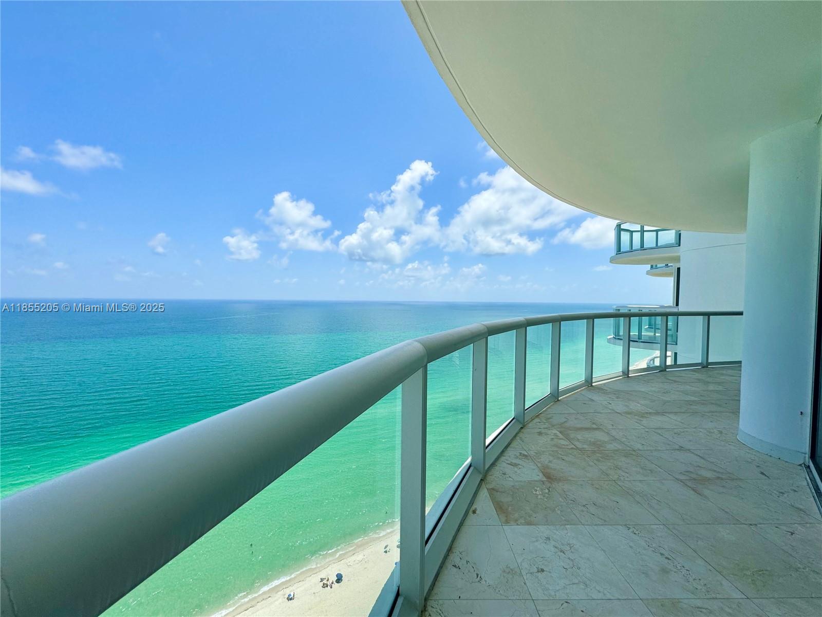 Spectacular direct ocean views from this 28th-floor unfurnished unit featuring two bedrooms and two bathrooms. Modern kitchen with stainless steel appliances, granite countertops, and an in-unit washer/dryer. One assigned parking spot included. Full amenities building, right on the ocean, offering 24/7 concierge and valet services, a state-of-the-art fitness center facing the ocean, beach service with chairs and umbrellas, an indoor squash court, a tennis court, BBQ grills, and a putting green. Centrally located near shops and entertainment, with small pets allowed.