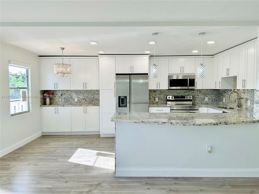 This is the one! This fully renovated 2nd-floor condo in Century Village Boca is a must-see! Featuring light wood laminate floors, a brand-new A/C system, and a stunning kitchen with custom wood cabinetry, stainless-steel appliances, rare granite countertops, and recessed lighting. Relax on the lanai with breathtaking water views and enjoy the open-concept layout, perfect for entertaining. Updated bathrooms, a new electrical panel, water heater, chandelier, window treatments, and storage unit add convenience. Steps from your corner parking spot, this 55+ gated community offers 24/7 security and amenities like Olympic pools, tennis, pickleball, a theater, clubhouse, and more.