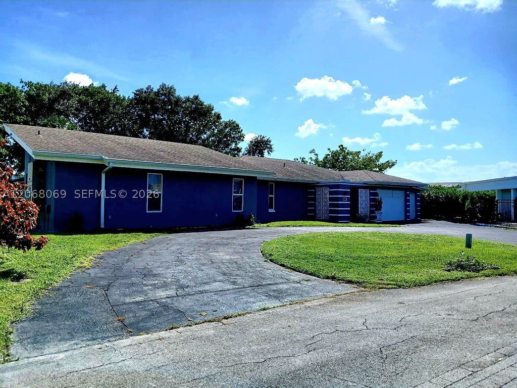 Photo of 5710 Melaleuca Dr, Tamarac, FL 33319 (MLS # A12068069)