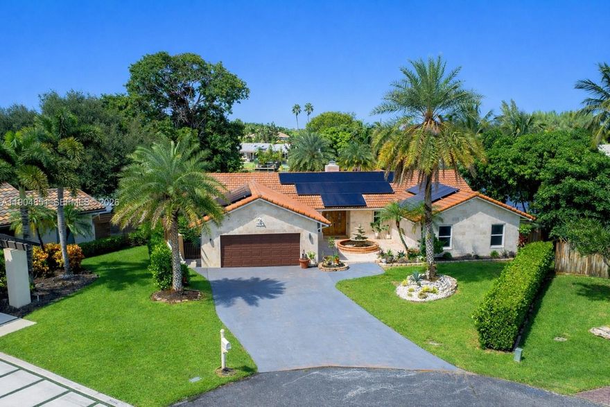 Location. Lot. View.
A rare opportunity to own a corner-lot waterfront home with the largest lot in the area and wide, unobstructed water views in one of Plantation’s most established residential communities.

Strategically located just 1 minute from I-595, offering effortless access to Fort Lauderdale, major business hubs, and the airport, while still enjoying a quiet, residential setting with spectacular sunset views reflected over the water.

This Mediterranean-style residence with Italian influences features 4 bedrooms plus a den, 3 bathrooms, a double-sided fireplace visible from two living areas, and a layout designed for both comfort and entertaining. Outdoors, enjoy a tile pool, expansive backyard, and unmatched open water scenery—ideal for relaxing or hosting gatherings.

Additional highlights include solar panels, no HOA, oversized driveway, two-car garage, and strong appreciation potential in a highly desirable location.

Minutes from Jacaranda Golf Club, a well-known Plantation landmark offering championship courses, lush landscaping, and an active golf and social lifestyle.

A unique waterfront property offering location, privacy, views, and long-term value—truly one of a kind in the area.