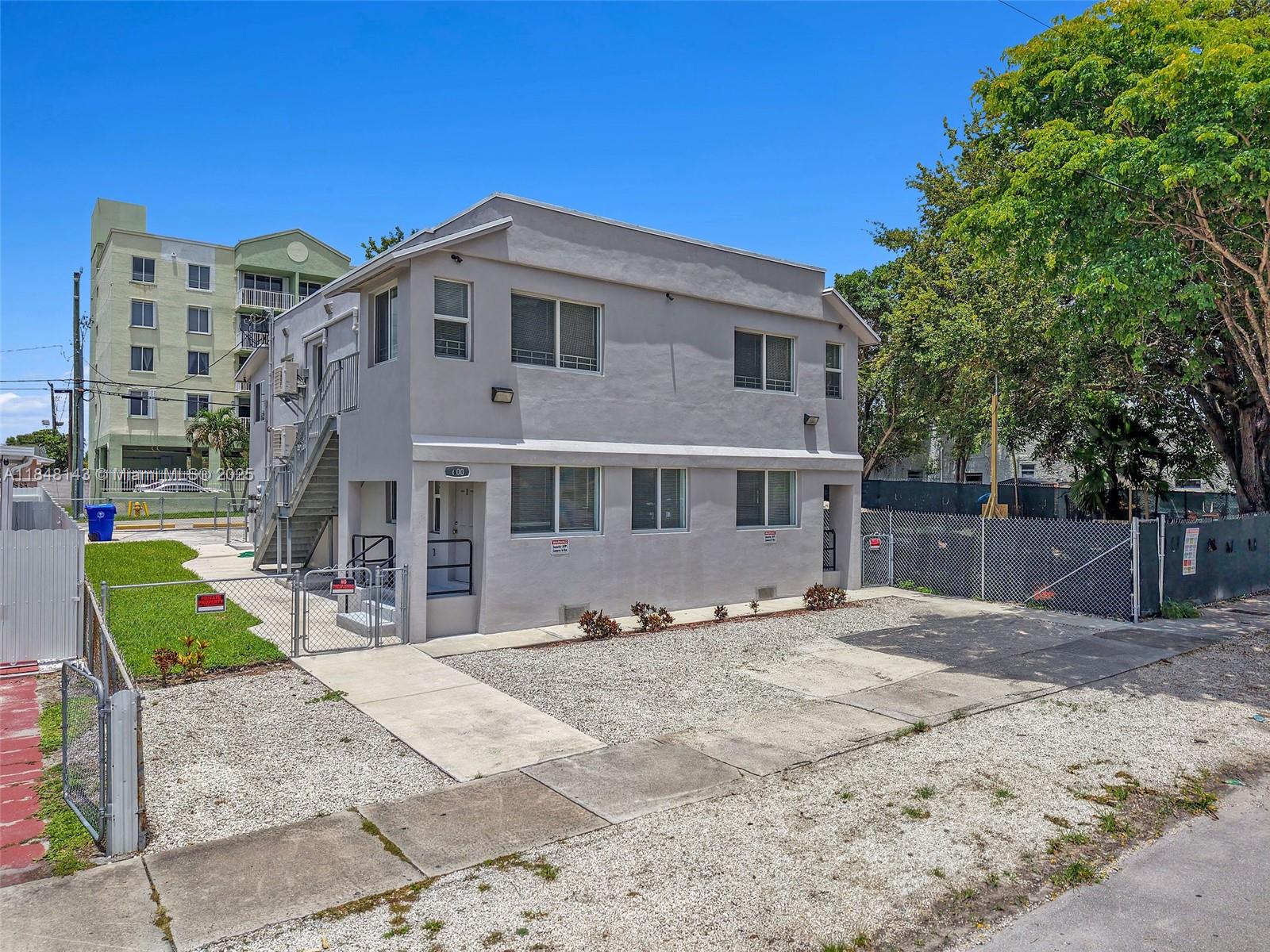 Completely remodeled 4-unit multifamily building in the heart of Miami, featuring four 2-bedroom, 1-bath units. Renovations completed with permits include a new roof, fully upgraded electrical system, impact windows, mini-split A/C units, tankless water heaters, and wood composite flooring. Each unit has washer/dryer hookups and dual private entrances. The two-story building spans 3,277 sq. ft. on a 5,350 sq. ft. T3-O zoned lot, with 6 parking spaces. Turnkey investment with modern upgrades and historic charm.
