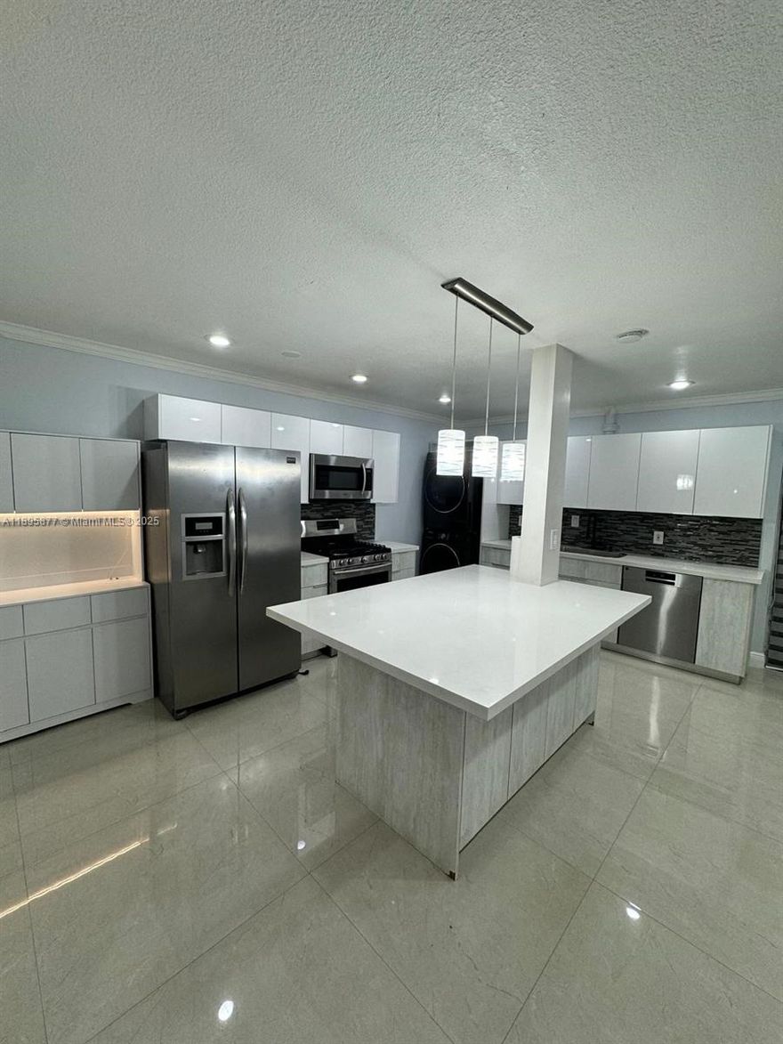 Gorgeous remodeled unit in very sought out community of The Country Club of Miami. No detailed were  spared when remodeling this beautiful unit. The exquisite open concept and modern kitchen is a culinary lover's delight. Porcelain flooring throughout, remodeled bathroom and custom built in walk-in  primary closet is sure to impress every buyer. Screened in balcony with privacy shade allows you to enjoy a spacious outdoor area to rejoice in the Lucious greenery and tranquility the community has to offer. Bring your pickiest buyer the unit show beautifully. PICTURES WILL BE UPDATED SOON!