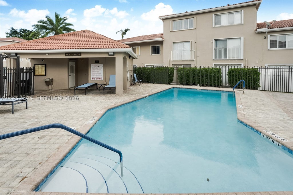 Photo of 221 Riviera Cir, Weston, FL 33326 (MLS # A12042244)