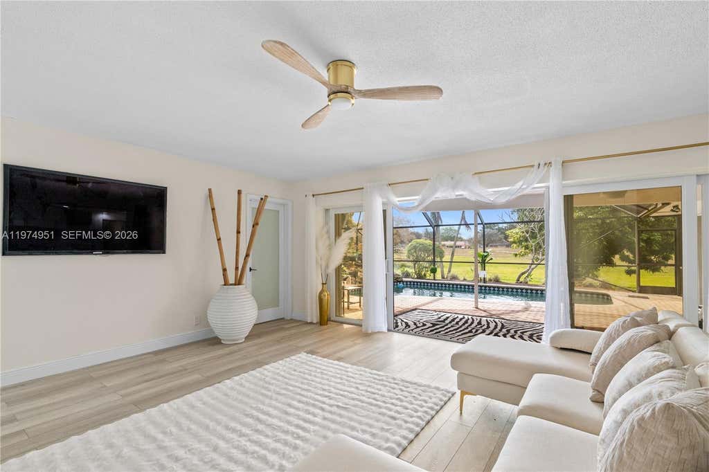 Photo of 5706 Guava Dr, Tamarac, FL 33319 (MLS # A11974951)