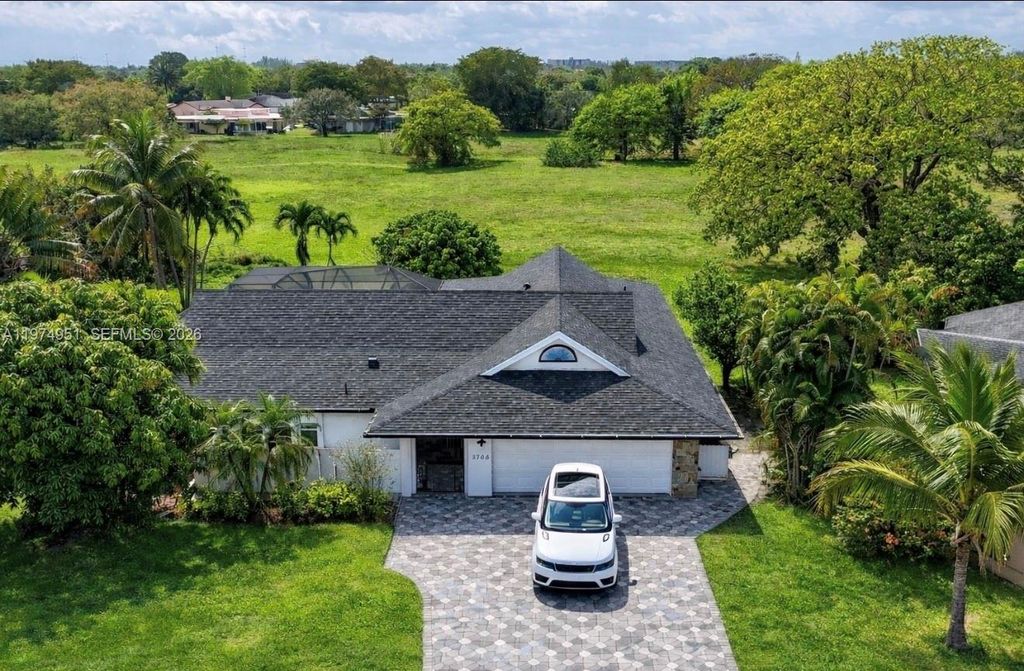 Photo of 5706 Guava Dr, Tamarac, FL 33319 (MLS # A11974951)