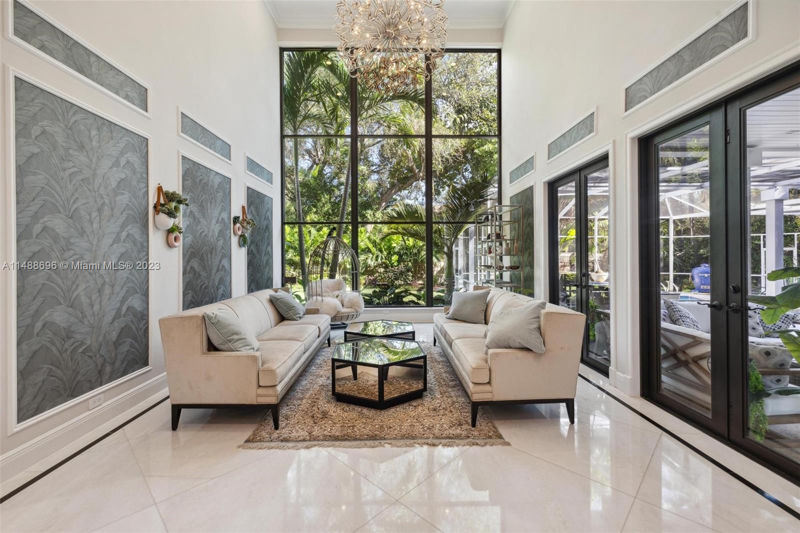Beautiful updated 2 story home offers sophisticated Miami living. Walk to main street Coconut Grove. Natural light throughout, windows galore. Solar panels, gas range, 2-EV chargers. Metal roof in 2007. Flood zone X. Coconut Grove ES, Ponce MS, Coral Gables HS. Set on a 1/4 acre, w/bay at the end of the street. Step into the atrium with high ceilings, marble floors & wood floor staircase. Welcome home to natural light over your pool area. Ideal for outdoor entertaining & enjoying the lush vegetation & back yard. 5 beds & 4/1 baths well distributed for easy living. 3-split plan layout. Enjoy a peaceful home while being steps away from some of the finest schools, shops, restaurants, & marinas. 15 minutes to the airport, downtown, golf, tennis & yacht clubs. Owned gas tank. Dog park nearby.