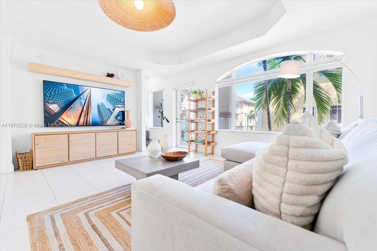 Beautiful Mediterranean-style 3-story townhome in a gated boutique community in the heart of Aventura. This private and tranquil residence features 2 bedrooms with en-suite baths, a spacious den/office on the first floor, open living with Italian cabinetry, and a garage with storage. Hurricane-impact doors and windows provide peace of mind, plus serene Intracoastal views from the south side. Family-friendly area with strong police presence near private schools and houses of worship. Amenities include pool, jacuzzi, fitness center, clubhouse, and landscaped gardens perfect for relaxing. Just 4 minutes to Aventura Mall, close to top schools, beaches, and more. Easy to show!