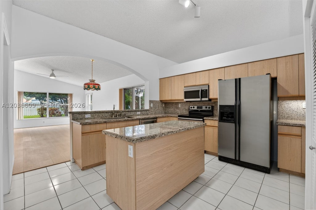 Photo of 1334 NW 127th Dr, Sunrise, FL 33323 (MLS # A12036609)