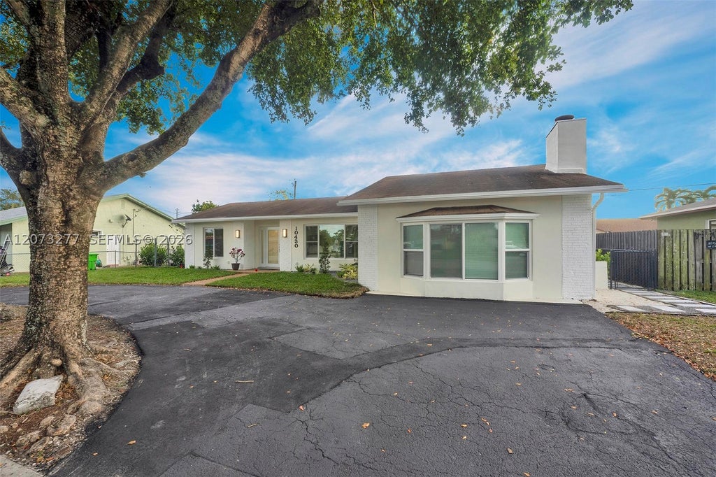 Photo of 10430 Sunset Strip #S, Sunrise, FL 33322 (MLS # A12073277)