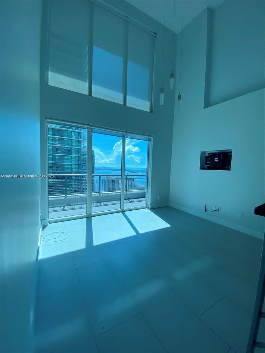 RENOVATED two story loft with double height ceilings. 2 beds / 2.5 baths, spacious floor plan with two extended balconies & gorgeous views of the Miami Skyline & Bay (East & West Views). Unit completely upgraded with lots of storage. Building offers a wide array of amenities including a spectacular roof deck, cafe, fitness center and spa, 24h front desk, full security, & more. Walking distance to Brickell City Center, the financial district, Publix, public transportation.