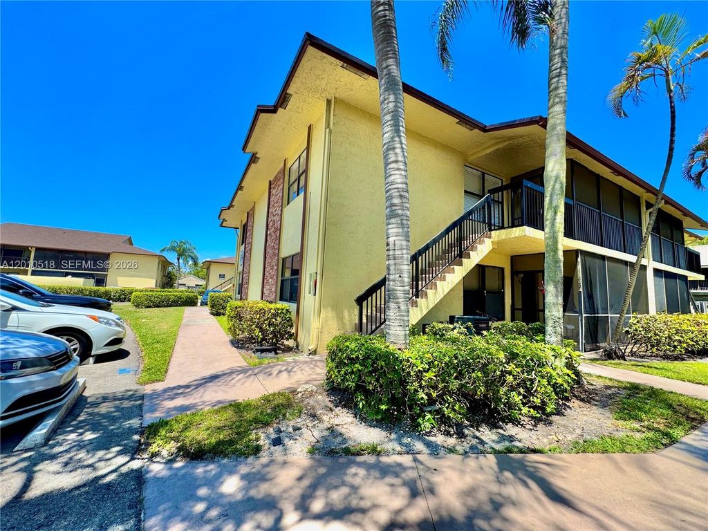 Photo of 10031 Winding Lake Rd #201, Sunrise, FL 33351 (MLS # A12010518)