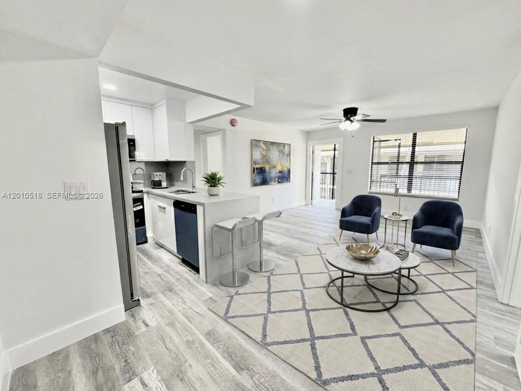 Photo of 10031 Winding Lake Rd #201, Sunrise, FL 33351 (MLS # A12010518)