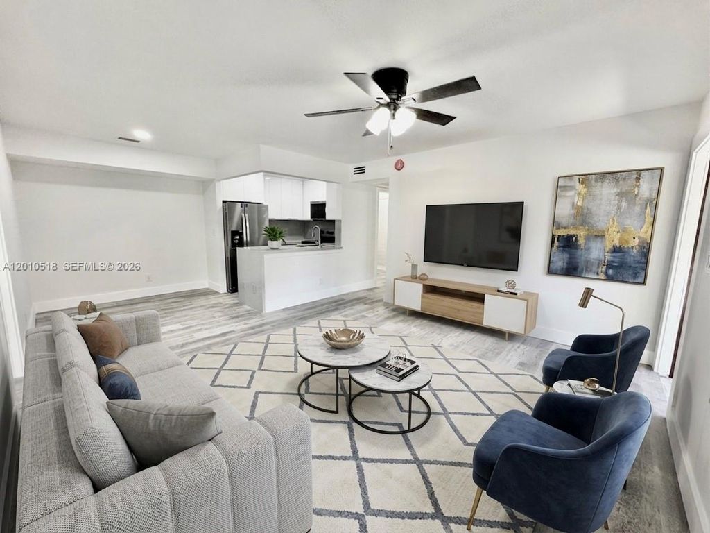 Photo of 10031 Winding Lake Rd #201, Sunrise, FL 33351 (MLS # A12010518)