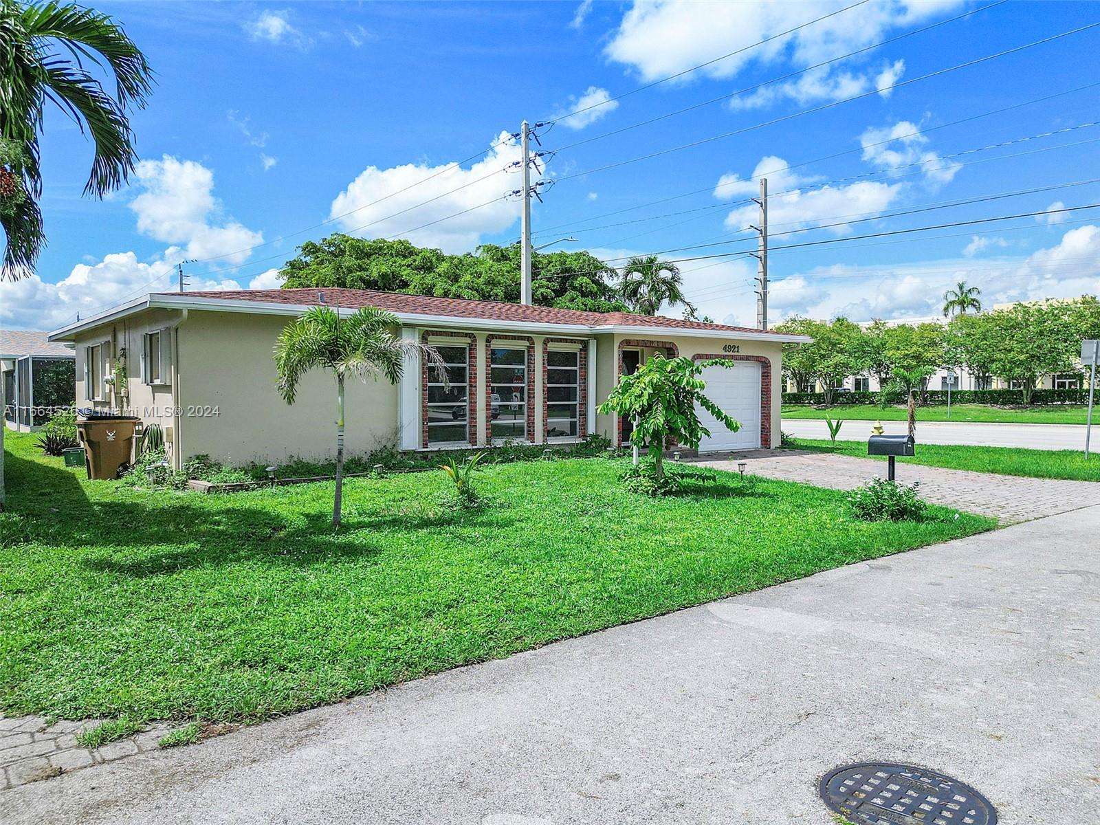 Welcome to this cozy 2-bedroom, 2-bath home in the heart of Deerfield Beach! Offering easy access to highways, shopping, restaurants, and beaches, it's a prime location for South Florida living. Inside, enjoy a spacious open layout with tile and laminate wood flooring. The home features a first-floor entry, walk-in closets, and a large screened patio with wood ceilings—perfect for year-round enjoyment. The one-car garage includes a washer/dryer and extra storage. Community amenities include a pool, plus storm shutters for peace of mind. Don’t miss this opportunity!