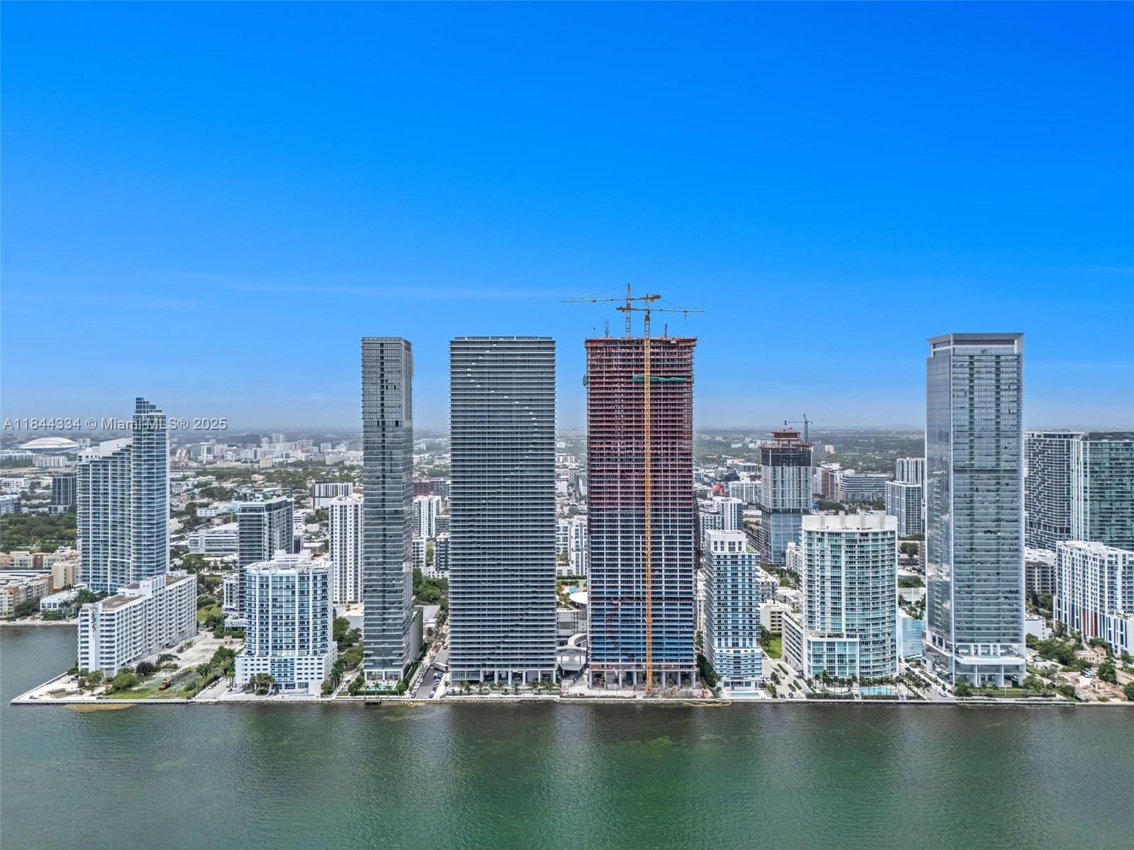 Experience unparalleled luxury at Aria Reserve Miami, where each meticulously designed residence boasts breathtaking, unobstructed water views. Immerse yourself in a lifestyle reminiscent of an elite country club, enhanced by world-class amenities: a private sports marina ideal for paddleboarding and kite kayaking, a whimsical splash park for children, and three pristine swimming pools—including two overlooking the water and a semi-Olympic pool perfect for tranquil sunset swims.
Maintain your wellness in a cutting-edge fitness center, all while savoring the seamless fusion of sophistication and vibrant coastal living. Perfectly positioned just 15 minutes from Miami International Airport, 7 minutes from the dynamic energy of Brickell, and mere moments from the Design District.