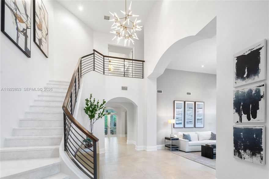 Live the ultimate country club lifestyle in Coral Gables within a prestigious, guard-gated community with 24/7 security. This beautifully updated estate offers refined design, everyday comfort, and effortless indoor-outdoor living, set alongside a championship 18-hole golf course and moments from a deep-water marina. Enjoy a premier location just minutes from downtown Coral Gables, Coconut Grove, and Miami International Airport, perfectly positioned to access Miami’s best dining, culture, and nightlife while preserving total privacy.

The main residence features 4 generously sized en-suite bedrooms, including an elevated second-floor primary suite with a private balcony and serene golf-course and courtyard views. A separate guest house adds a 5th bedroom, full bath, kitchen, living room, and its own balcony, creating the ideal space for visitors or extended stays. The resort-style courtyard and sparkling pool connect both homes, enhanced by peaceful bay breezes. A standout outdoor summer kitchen, wrapped in bold blue tile with a built-in bar and grill, completes the backyard retreat. Fully furnished, rare end lot, unmatched tranquility.