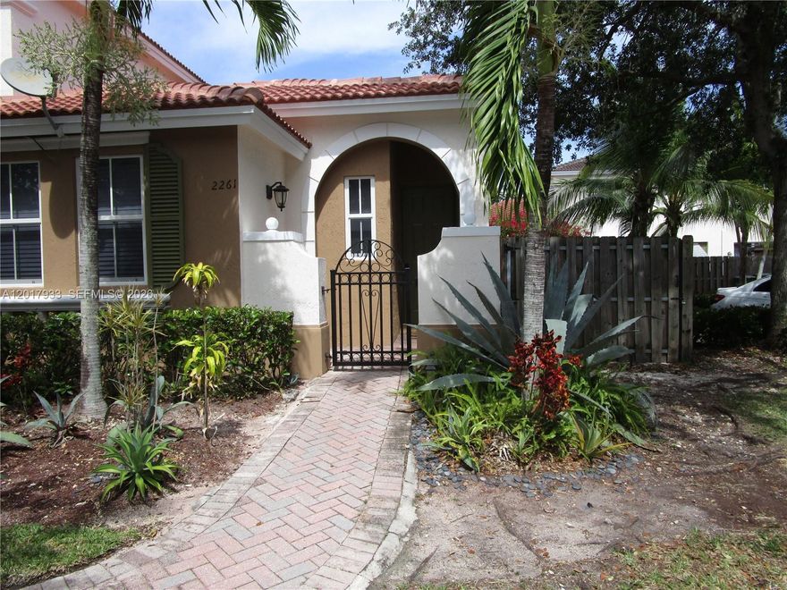 Nice corner two bedroom and two bath townhome available for rent! This one story property features a split bedroom layout with stainless appliances in the kitchen, tile and laminate wood floors. impact windows and sliding glass door. It has a spacious back patio and side with a wooden privacy fence. This community has a wonderful clubhouse, pool and more. Pets are welcomed. Located in WATERSTONE, Marbella Cove is a gated community with plenty of guest parking. Move in ready and easy to see!!!
