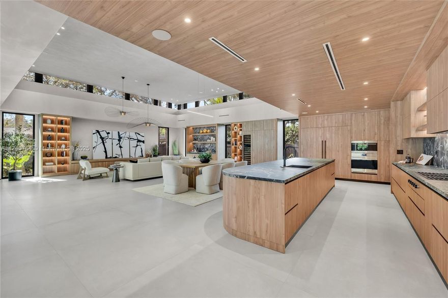 Tucked away on a lush, secluded cul-de-sac in Biscayne Park, this brand-new 2025 luxury estate is a timeless masterpiece, seamlessly blending modern design with natural beauty and the finest quality finishes. Spanning 6,680 sqft, this 6-bed, 7.5-bath residence is bathed in sunlight, effortlessly merging indoor and outdoor living. Soaring ceilings, bespoke wood millwork, and a chef’s kitchen exude sophistication, while quadruple closets, a massive walk-in, and a staff room ensure ultimate functionality. Lush landscaping envelops a private oasis with an automated saltwater pool, high-efficiency A/C, and a handicap-accessible ramp. A rare gem in Miami’s prime Upper East Side location!