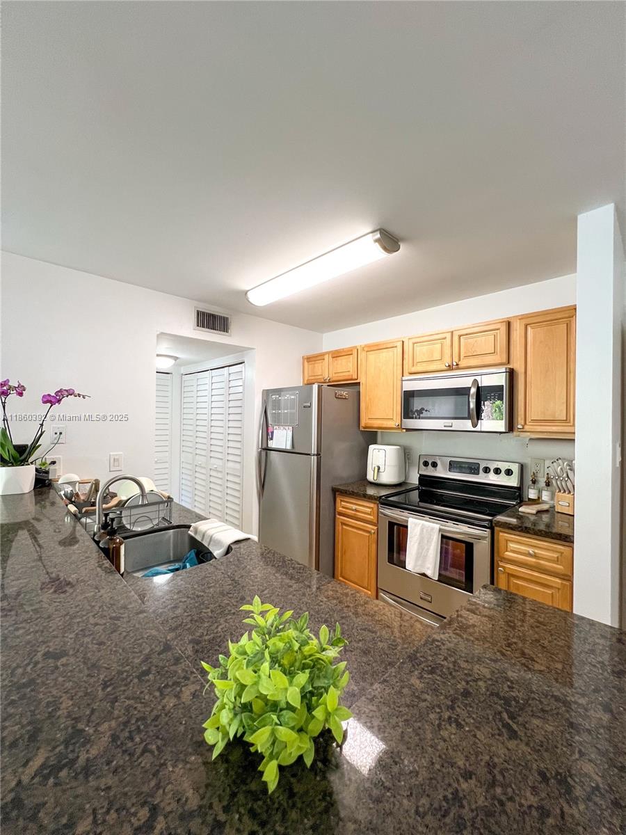 This well-maintained & renovated condo features a split floor plan with two master suites—one with his & her closets and the other with a walk-in closet. Enjoy high ceilings (no popcorn!), plenty of storage, and new doors throughout. The kitchen offers stainless steel appliances, wood cabinets, and granite countertops, plus a newer washer & dryer inside. Relax on your private balcony with storage, complete with hurricane shutters on all windows and sliding doors.
The Royal Palm complex includes a pool, gym, remodeled basketball & tennis courts, playground, 24-hour security, and gated entry with cameras. Within the desirable Hammocks community, residents also enjoy a clubhouse, 3 pools, and gym—all in a family-oriented neighborhood near shopping, dining, and schools.