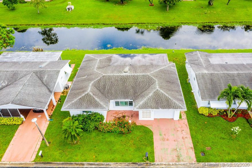Serene canal view from this 2/2 in Paradise Gardens!  Property features an updated kitchen (granite countertops, new appliances, new cabinets), one-car garage, laminate wood and carpet floors, hurricane impact windows so much more. Make this your home today!