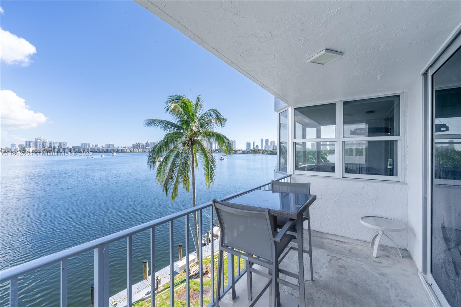 Spacious fully renovated corner unit 2BR/2BA waterfront condo with over 1,300 sq ft in desirable gated Eastern Shores. Bright open layout with large living/dining area and private balcony offering serene Maule Lake views. Northern exposure fills the space with natural light. Residents enjoy resort-style amenities including pool, fitness center, tennis courts, sauna/spa, BBQ/picnic areas & boat dock access. Extra conveniences include covered parking, elevator & laundry facilities. Prime location minutes to Sunny Isles Beach, Aventura Mall, Oleta River State Park, dining, shopping & highways. Close to top-rated schools. Only 8 minutes to FIU Biscayne Bay Campus. Offered furnished or unfurnished for flexibility. 27-ft dock available with unit for additional fee. Vacant.