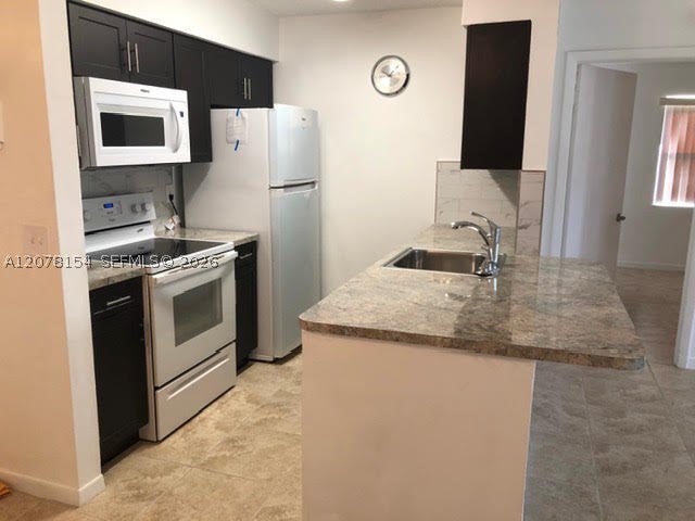 Photo of 700 NW 103rd Ter #101, Pembroke Pines, FL 33026 (MLS # A12078154)