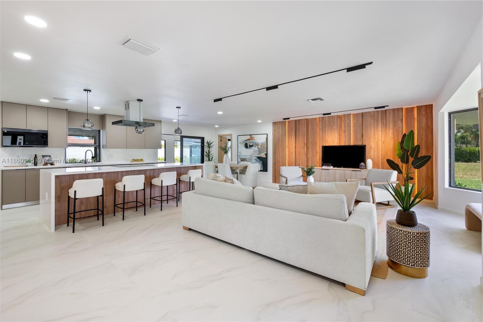 This beautifully fully renovated home is a total showstopper! The meticulous attention to every detail throughout this European-inspired design creates a truly gorgeous living space. Luxurious 3 Full Suites with 3 full Bathrooms. Brand New 2025 Roof Ensures Durability & Longevity. New 2025 impact windows, 2025 AC System and Fully Upgraded Electrical & Plumbing Systems - everything here was done with City Permits and meet Standards! 2 car garage and indoor laundry. Less than a 5 minute drive to the beach. Prestigious Coral Ridge neighborhood perfect for idlillic South Florida living. With Some Of The Highest Rated Schools Country Wide! This Is A Must See!