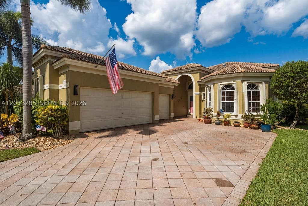 Photo of 5818 NW 126th Ter, Coral Springs, FL 33076 (MLS # A12052285)
