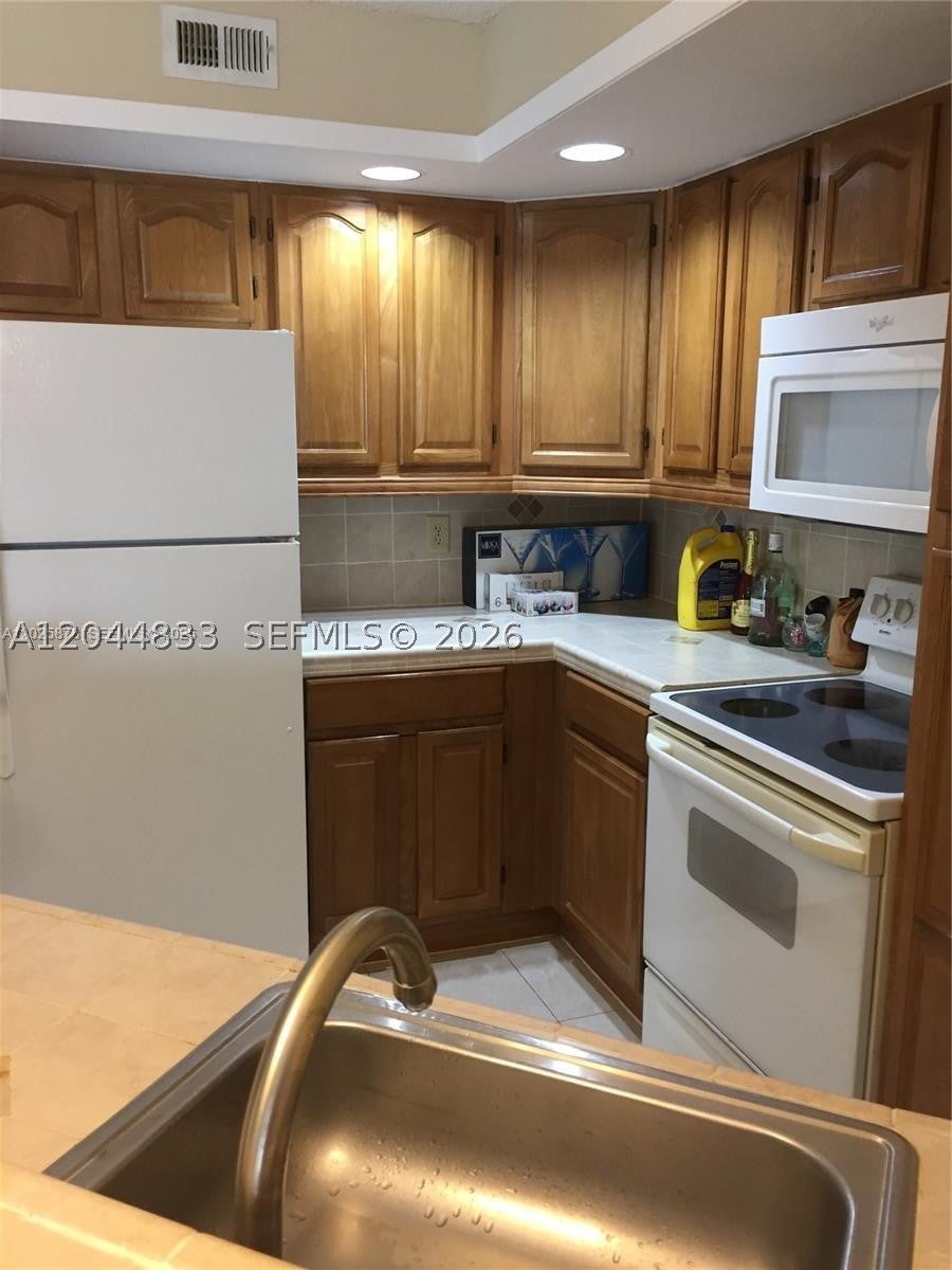 Photo of 12870 Vista Isles Dr #517, Sunrise, FL 33325 (MLS # A12044833)
