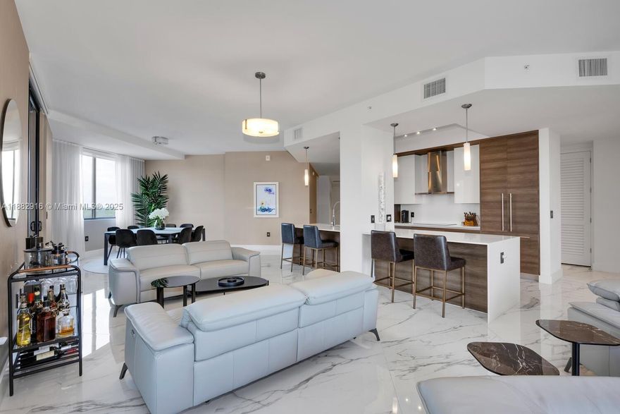 The largest residence in Merrick Manor, this impressive LPH corner unit showcases 4BR & 4BA with a thoughtfully designed split floor plan. The private primary suite features a spa-style bath & custom closets, while a true junior suite offers comfort, complemented by 2 additional bedrooms ideal also for office use. The chef’s kitchen boasts sleek cabinetry & an expansive island that seamlessly connects to open living & dining areas. A large terrace invites sweeping views & abundant natural light. Interior highlights: porcelain flooring, impact glass, keyless entry & 2 garage spaces. Amenities: concierge, valet, pool, fitness center & a club lounge. Steps from the Shops at Merrick Park & minutes to UM & Miracle Mile, this penthouse epitomizes “The City Beautiful” lifestyle.