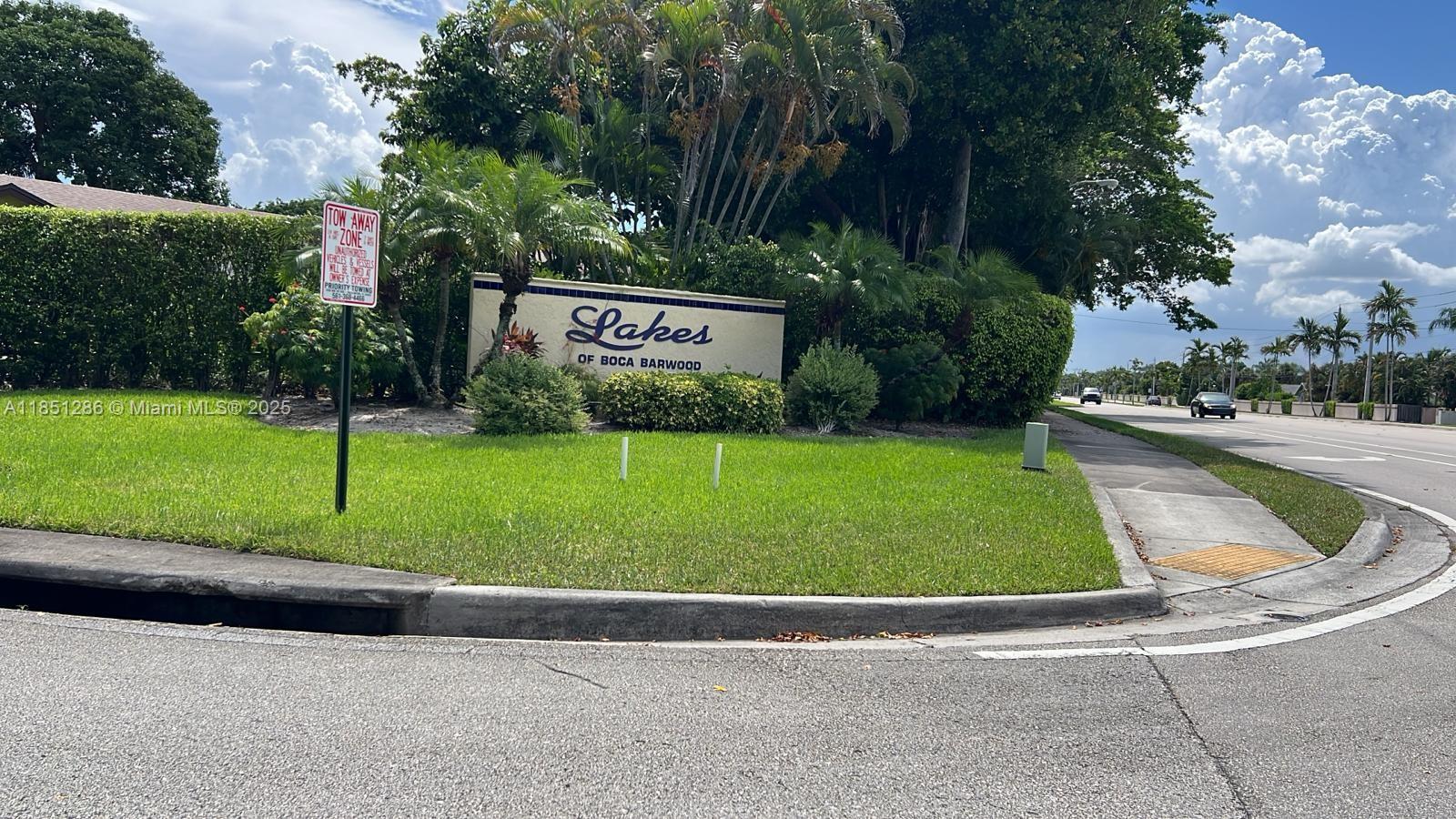 Corner villa in a wonderful 55+ community—The Lakes of Boca Barwood! This 2-bed, 2-bath villa is move-in ready and offers beautiful garden views, vaulted ceilings, and lots of natural light. Enjoy a large screened patio perfect for relaxing or entertaining. Freshly painted with neutral tones and new flooring. Features include split-bedroom layout, oversized primary suite with walk-in closet, in-unit laundry, and deeded covered parking with storage. Low monthly fee includes landscaping and amenities: pool, tennis, walking trails, clubhouse, and more. Pet-friendly and close to shopping, dining, and major roads. Near Mizner Park, Boca Raton Museum of Art, Butterfly World Morikami Gardens, and Sunset Cove Amphitheater. Don’t miss upscale shopping at Town Center Mall.