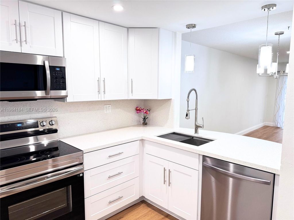 Photo of 8846 W Mcnab Rd #106, Tamarac, FL 33321 (MLS # A11984184)