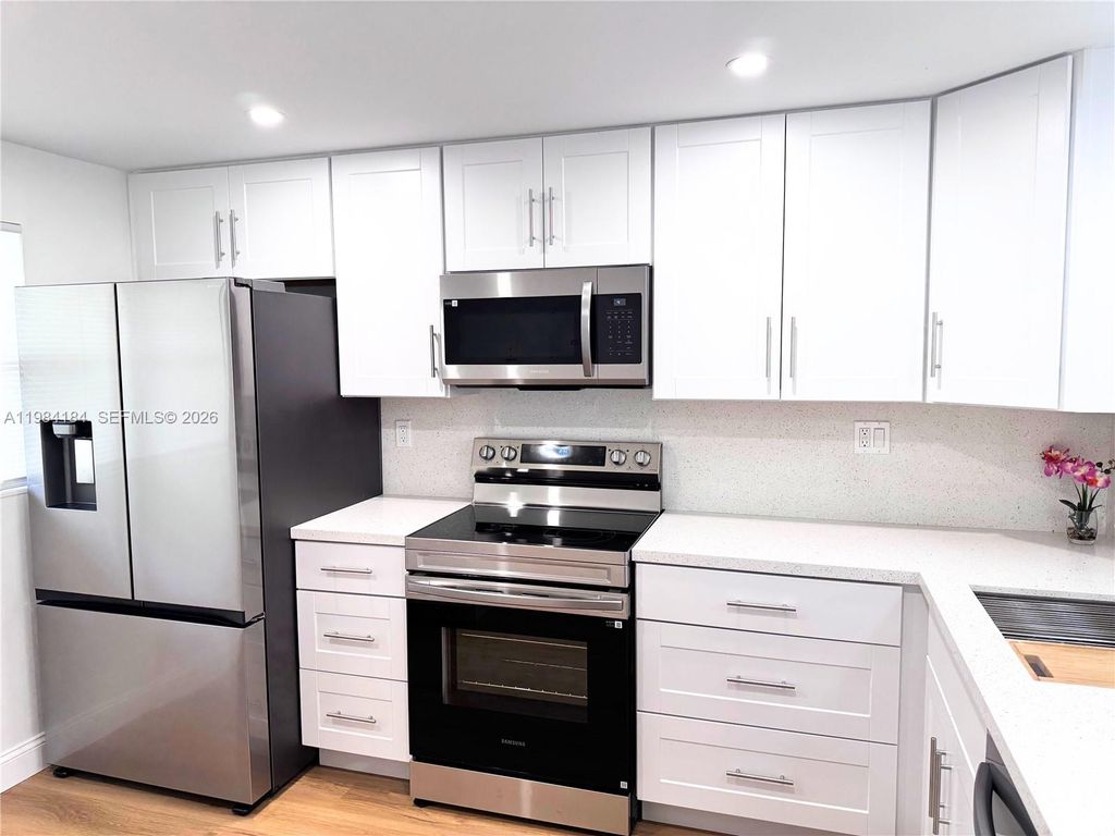 Photo of 8846 W Mcnab Rd #106, Tamarac, FL 33321 (MLS # A11984184)