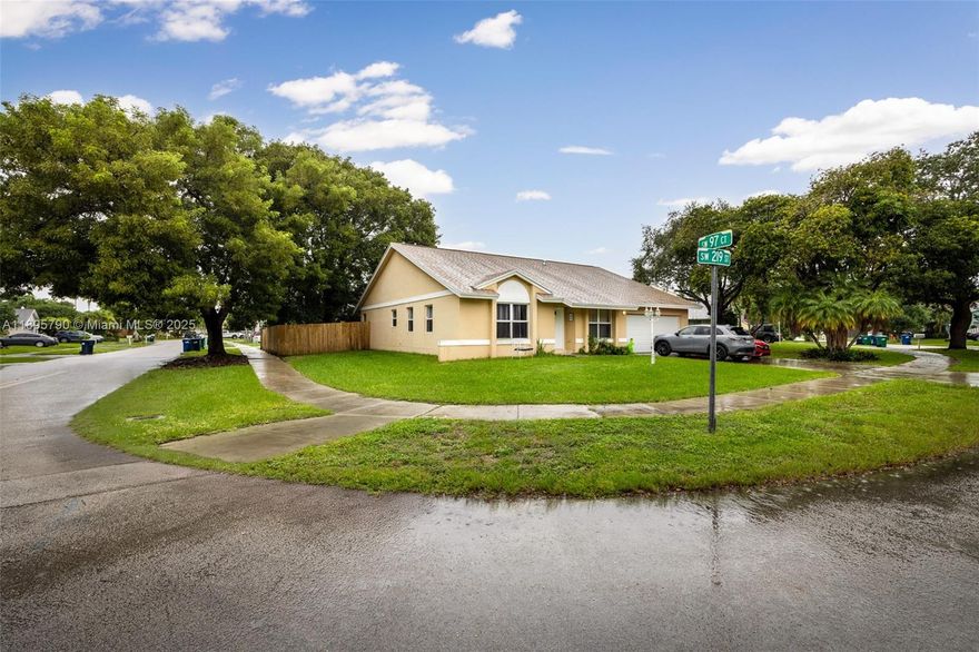 Beautifully positioned on a spacious corner lot in Lakes by the Bay, this bright and airy 4-bedroom residence offers high ceilings, a thoughtful split layout, and abundant natural light throughout. The expansive kitchen includes a pantry and opens seamlessly to the dining and living areas—perfect for everyday living and entertaining. Enjoy the large, fenced backyard with mature fruit trees and room for a pool, ideal for outdoor gatherings. Additional features include hurricane shutters, a utility/laundry room, and an attached 2-car garage.