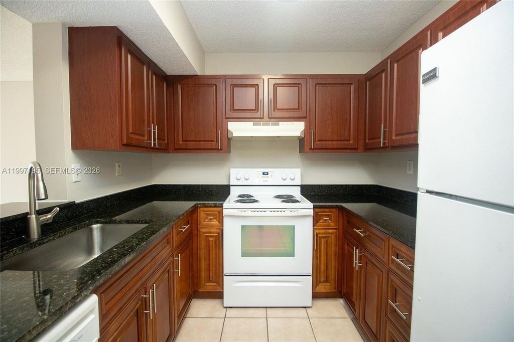 Photo of 9491 S Palm Cir S #101, Pembroke Pines, FL 33025 (MLS # A11997195)