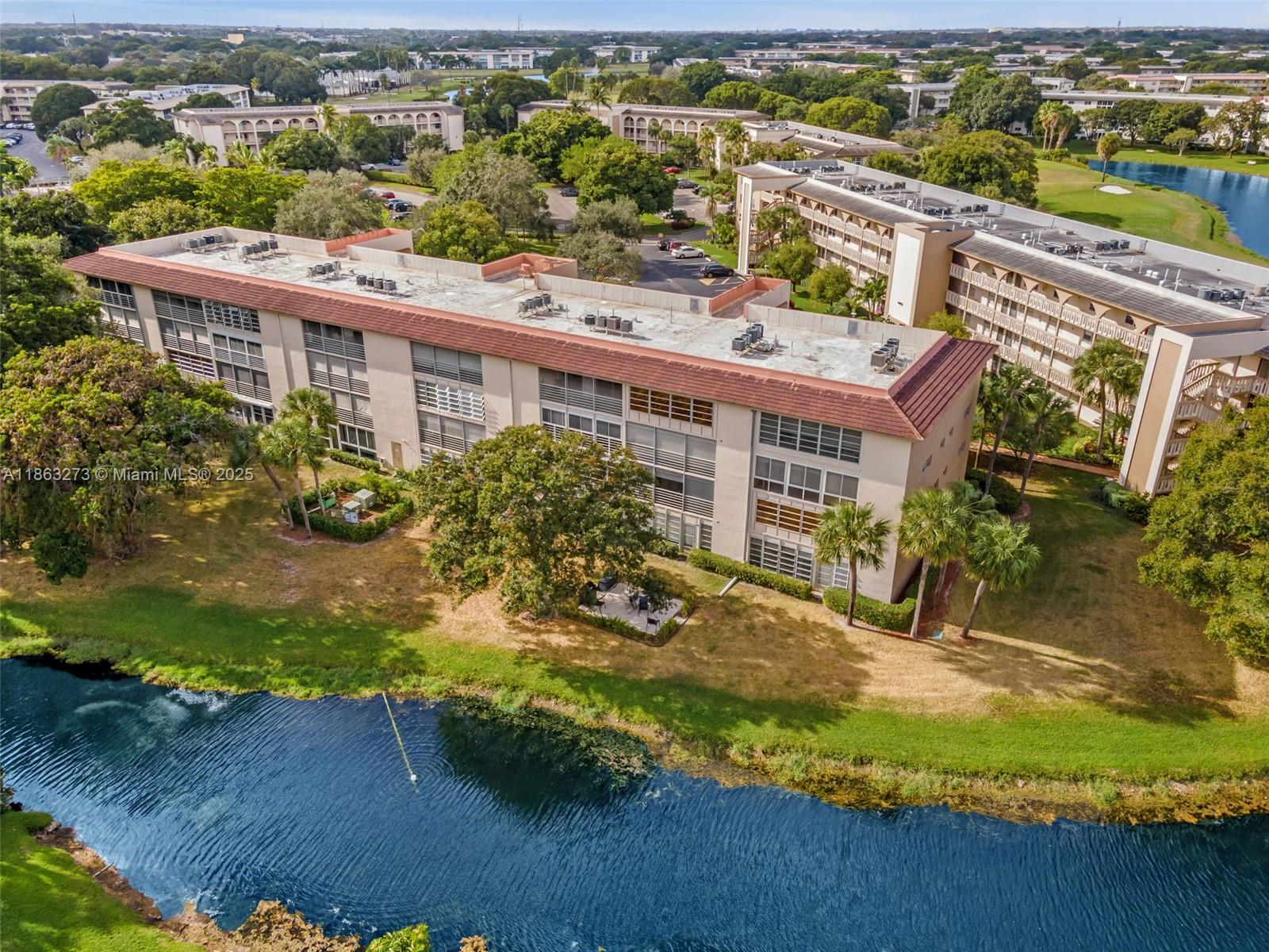 Do not miss out on this PENTHOUSE. NO ONE ABOVE YOU. MOTIVATED OVERSEAS SELLER! LARGE AND BRIGHT 2/2 was just repainted with LAKE VIEWS. Both bedrooms are private and have large ensuites. The kitchen is bright and off of a large and bright dining area. The balcony is large with stunning views. Washer and dryer on the same floor. It is nice and quiet in one of the best OVER 55 communities. Now is your chance to experience Wynmoor at an affordable price. A private building pool is right next to the building and a large clubhouse pool is nearby with a theater and other activities. Cable and WIFI are included!