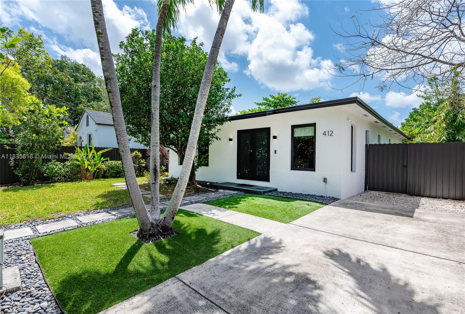 WELCOME TO CASA BELLA – A LUXURY OASIS IN BUENA VISTA! Built in 2002 and FULLY UPDATED in 2024, this 3BR/2BA blends MODERN ELEGANCE with TROPICAL SERENITY. Features BOSCH CHEF KITCHEN with 10' ISLAND, IMPACT WINDOWS, WOOD FLOORS, UPDATED BATHS, 2021 ROOF, RECESSED LIGHTING, ROMAN SHADES, AMPLE CLOSETS, and DOUBLE GLASS ENTRY DOORS. Bright OPEN LAYOUT flows to 400 SF COVERED DECK surrounded by AVOCADO and JASMINE TREES, GRAPEVINE, MULBERRY and VIBRANT FLOWERS. FULLY FENCED with GATED DRIVEWAY. VIVINT SECURITY SYSTEM. WALK to DESIGN DISTRICT & MIDTOWN; mins to WYNWOOD, DOWNTOWN, SOBE and MIAMI Airport. FULLY FURNISHED, TURNKEY & MOVE-IN READY. Available 6 months max. Non smokers only.