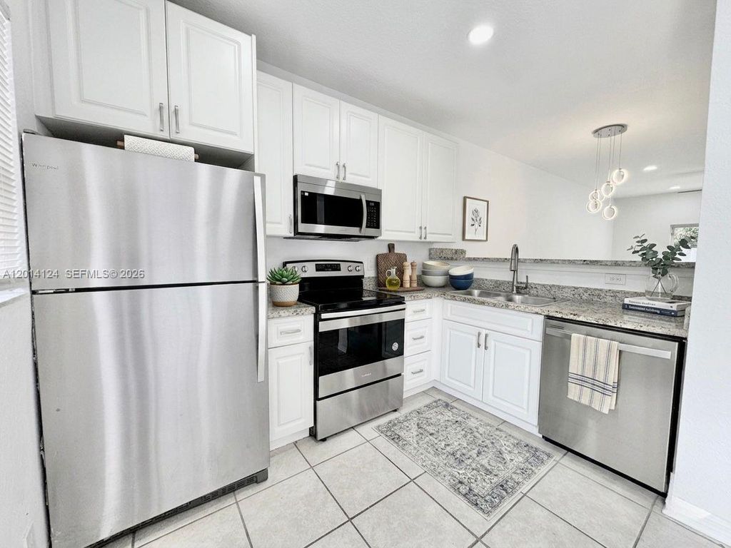 Photo of 3670 NW 91st Ln #3670, Sunrise, FL 33351 (MLS # A12014124)